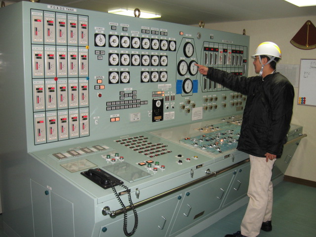In a cargo control room monitoring gas cargo pressure